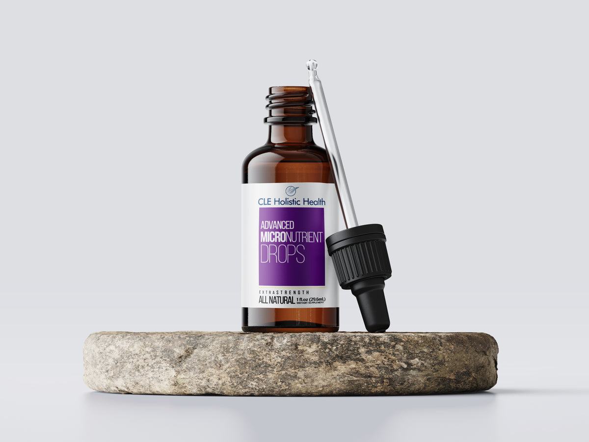 CLE Advanced Micronutrient Drops bottle with dropper on a stone